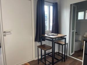 a small table in a room with a window at Wannanup Retreat - Sleeps 2 - Pet Friendly in Wannanup +35 photos