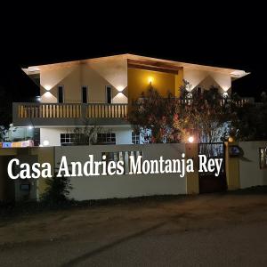 a building with a sign that reads casa and cities montmartinian key at Casa Andries Montanja Rey in Willemstad