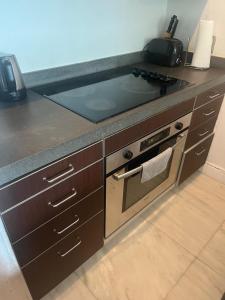 a kitchen with a sink and a stove top oven at Knickerbocker 102 in Miami Beach +6 photos