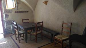 a dining room with a table and chairs at Chez Corban in Rosans