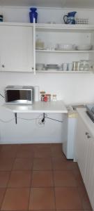 Η κουζίνα ή μικρή κουζίνα στο Rose Cottage +6 φωτογραφίες