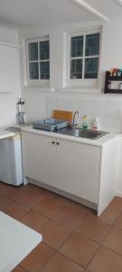 Η κουζίνα ή μικρή κουζίνα στο Rose Cottage