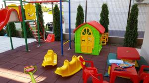 a playground with colorful play equipment on a patio at Nobel Residence in Mamaia Sat/Năvodari