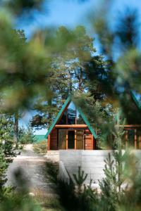 a small wooden cabin in the middle of trees at Wood heaven in Žabljak