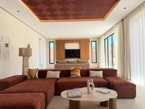 TV a/nebo společenská místnost v ubytování Villa Terracotta Marrakech