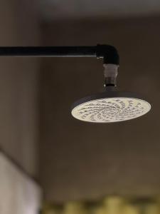 a light hanging from a ceiling with a sink at LuxAfrique Rentals in Lekki