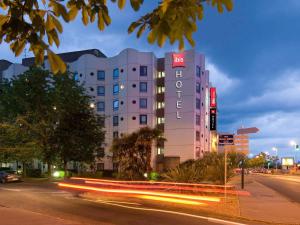 a building with a hotel sign on the side of a street at ibis Tours Centre Gare in Tours