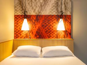 Postel nebo postele na pokoji v ubytování ibis Gent Centrum Opera