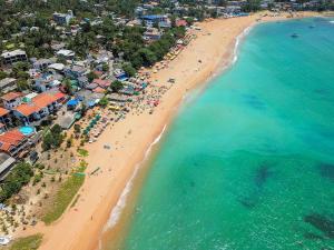 an overhead view of a beach with a crowd of people at Sajee Residence Trincomalee in Trincomalee +68 photos