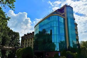 a building with glass windows on the side of it at Park Hotel Diament Bielsko-Biała in Bielsko-Biala