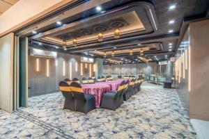 a conference room with a long table and chairs at The White Seasons in Gwalior