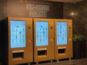 a row of iphone vending machines in a building at Dorsett Tsuen Wan, Hong Kong in Hong Kong