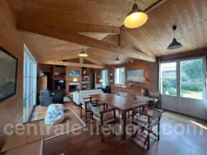 a dining room with a table and chairs at La Villa de Hurlevent in Les Portes