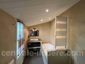 a small kitchen with a sink and a ladder at La Villa de Hurlevent in Les Portes