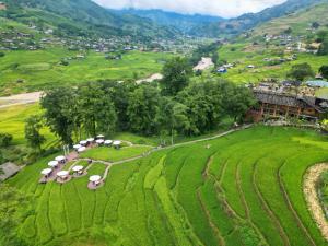 an aerial view of a farm in a field at MT House With Mountain View - Sa Pa Trekking Tour in Sa Pa