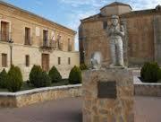 a statue of a man standing in front of a building at Fuerte de San Mauricio in Palazuelo de Vedija