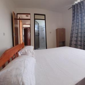 Ένα ή περισσότερα κρεβάτια σε δωμάτιο στο Mihambos Apartments