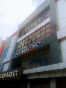 Un edificio con el cartel de mi agencia de investigación. en M k residency, en Ernakulam