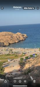 a view of a beach and the ocean at Belle cote appartement al hoceima in Al Hoceïma