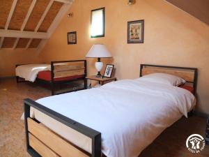 Postel nebo postele na pokoji v ubytování A la fermette de Limesle