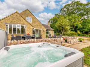 a hot tub in the backyard of a house at 4 Bed in Alsop-En-Le-Dale 88935 in Alsop en le Dale