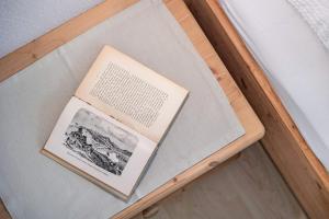 a book sitting on top of a table at Unterlacherhof Ahrntal in San Giacomo