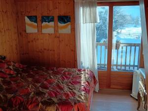 Postel nebo postele na pokoji v ubytování Le chalet de Julbert