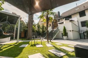 a yard with a swing and a playground at BS Milla Estate Heidelberg in Heidelberg