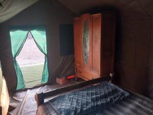 Ένα ή περισσότερα κρεβάτια σε δωμάτιο στο Rooidakkies +40 φωτογραφίες