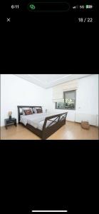a picture of a bedroom with a bed and a window at RDC Villa avec Jardin & Piscine Privée in El Aouina Station