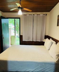 Ένα ή περισσότερα κρεβάτια σε δωμάτιο στο Chalé Tia Sofia 7