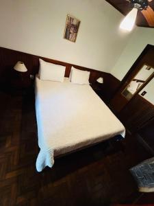 Ένα ή περισσότερα κρεβάτια σε δωμάτιο στο Chalé Tia Sofia 7