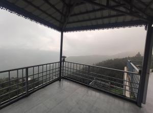 a view from the top of a building with a balcony at Voga View Hotel and Restro in Mussoorie
