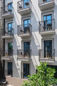 a facade of a building with balconies at Sapiens Hotel in Tashkent