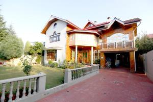 a large house with a fence in front of it at Nuh Villa - Luxury stay with Kashmiri Warmth in Srinagar