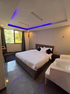 Ένα ή περισσότερα κρεβάτια σε δωμάτιο στο Green Executive Hotel
