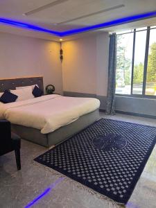 Ένα ή περισσότερα κρεβάτια σε δωμάτιο στο Green Executive Hotel