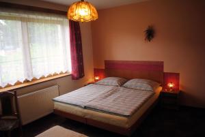 Postel nebo postele na pokoji v ubytování Pension B&B