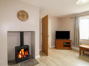 Et tv og/eller underholdning på Wigley Farm House Cottage