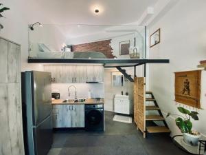a small kitchen with a sink and a refrigerator at Sophia Loft Luxury Stay with Parking in Athens