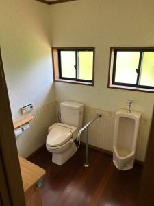 a bathroom with a toilet and a urinal at アットホーム五島 in Goto +18 photos