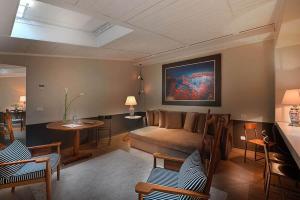 a living room with a couch and a table at Maison Borella in Milan