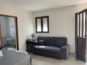 a living room with a couch and a table at Casa Da Laija in Cova