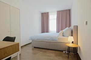 a bedroom with a bed and a window at Spacious family apartment in Bamberg in Bamberg