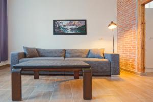 a living room with a couch and a coffee table at Romantic apartment in Bamberg in Bamberg +13 photos