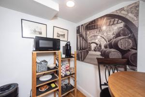 a room with a wall mural of a wine cellar at Eagle's Landing - Logan Airport in Boston