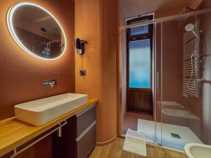 a bathroom with a sink and a shower and a mirror at Blu Rooms - Rooms to Rest by Host Hero in Civitanova Marche