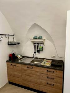 a kitchen with a sink and a counter top at Casa Vacanza L'Aurora in Vico Equense +1 photo