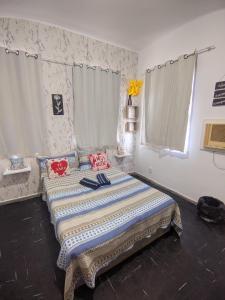 Ένα ή περισσότερα κρεβάτια σε δωμάτιο στο Pousada casa verde mar