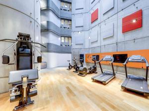 a gym with several treadmills and exercise bikes at Novotel Paris Gare De Lyon in Paris